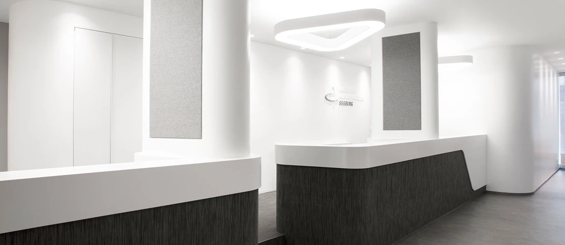 A striking triangular pendant light sets stylish accents and provides targeted illumination of the reception area.