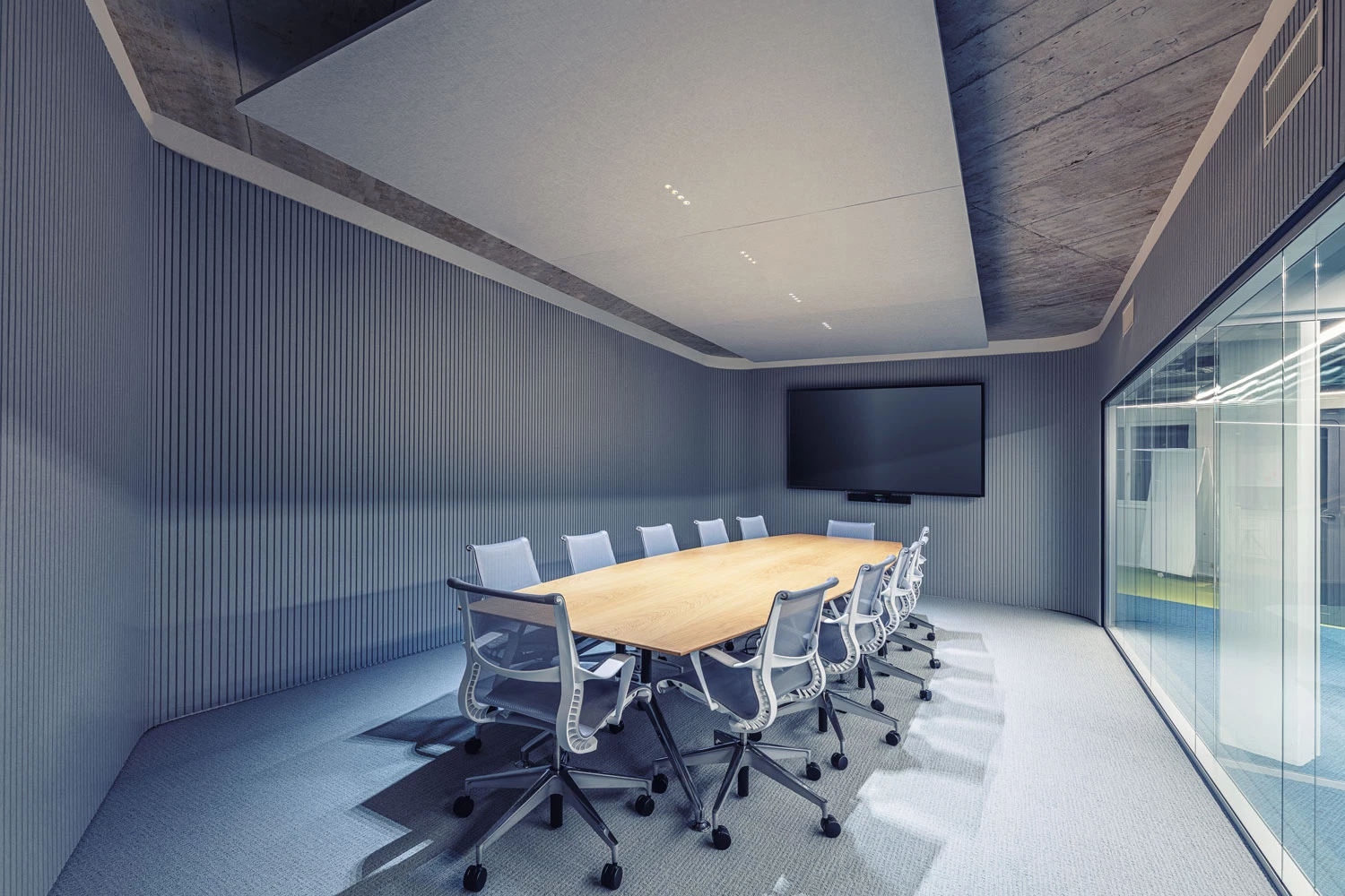 Luminaire acoustique pour plafond pour une atmosphère de réunion agréable.